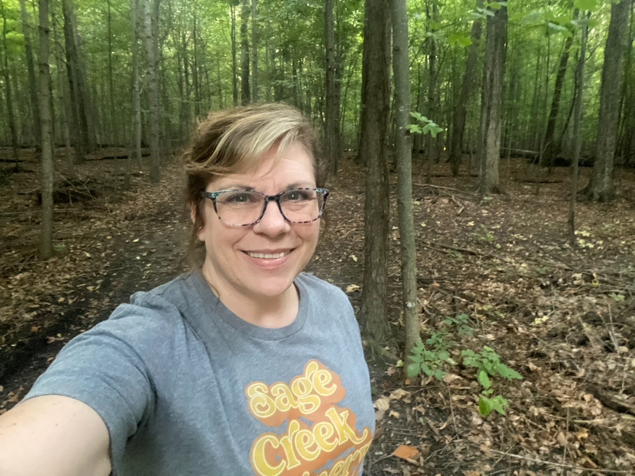 Office Manager Diane out hiking trails near her home