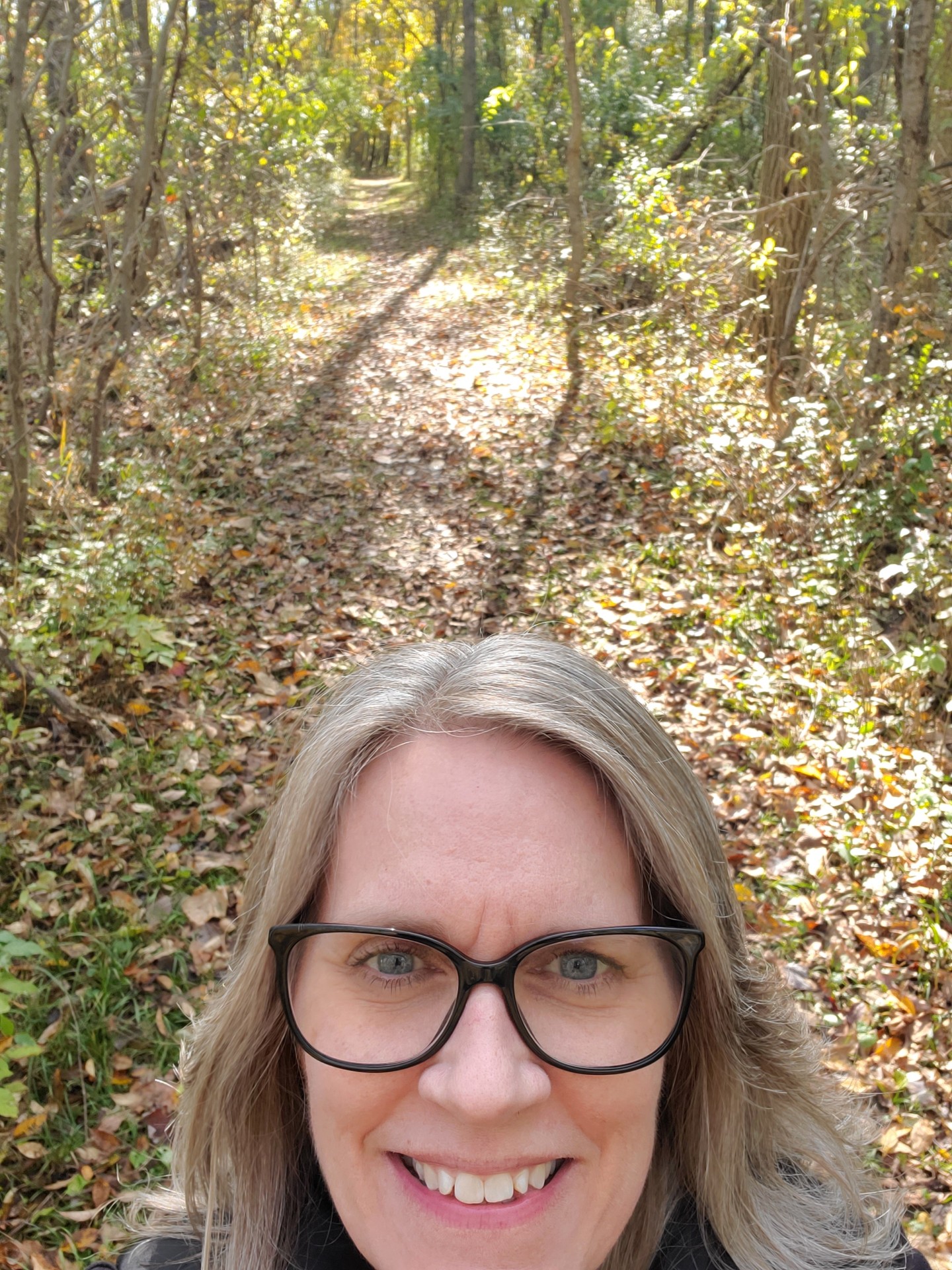 Amy trekking the trails at Seven Ponds on a beautiful fall day