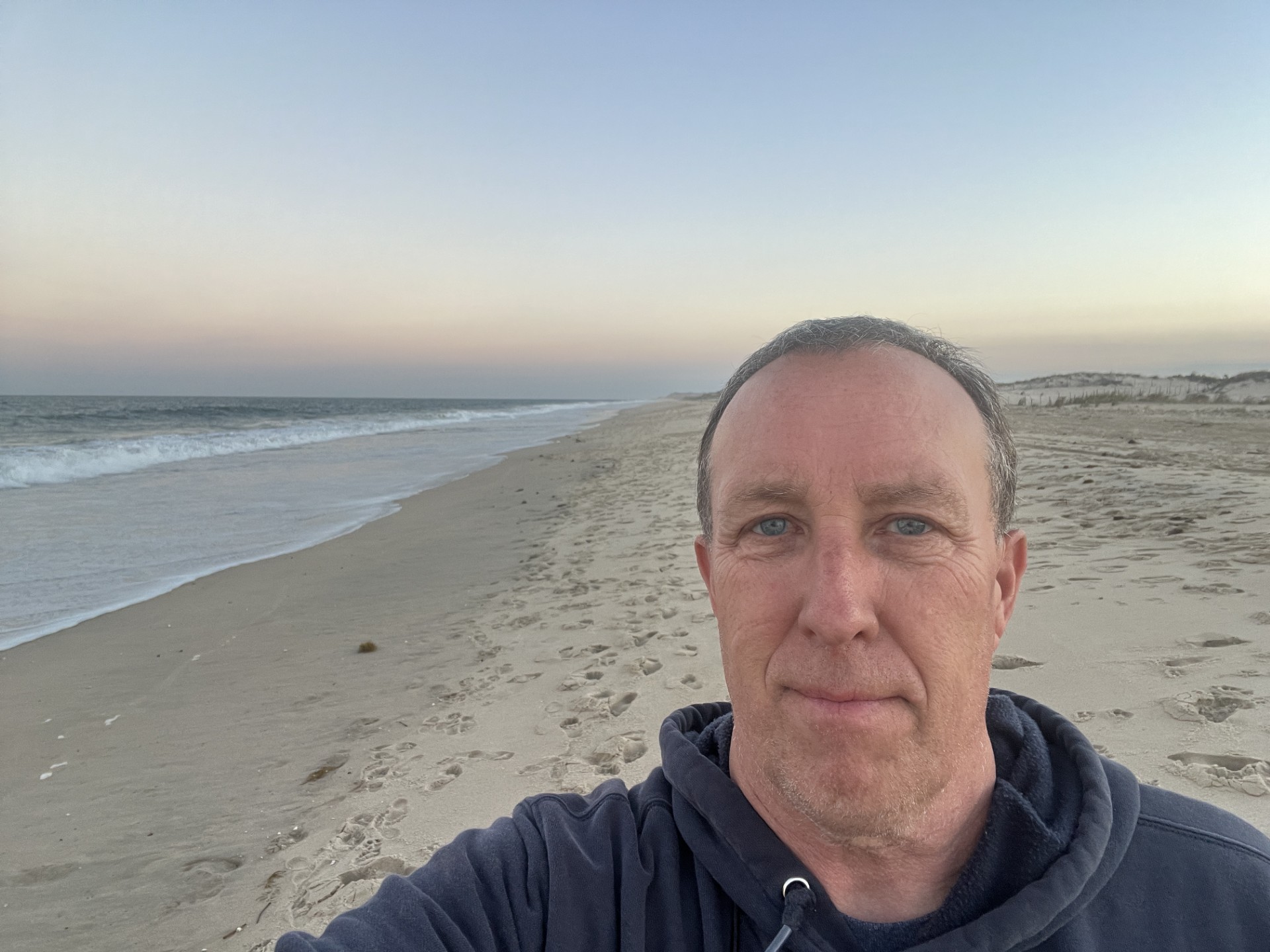 Daryl trekking along the Atlantic coastline in Delaware